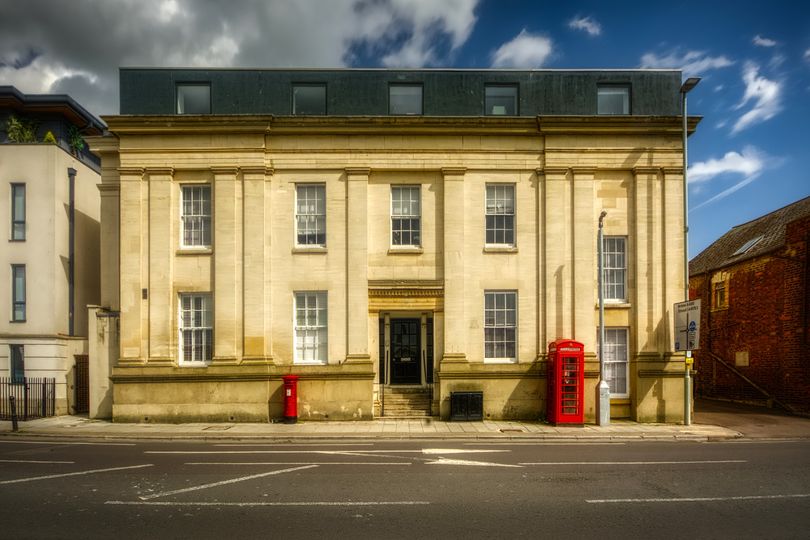 Albion House on Southgate Street, built 1831 as the Albion Hotel, with 1936-design K6 telephone kiosk.
