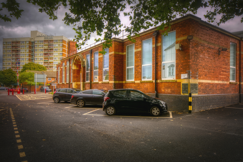 Clapham Court tower block on the former fields of Monkleighton viewed from the Gloucestershire Heritage Hub off Alvin Street