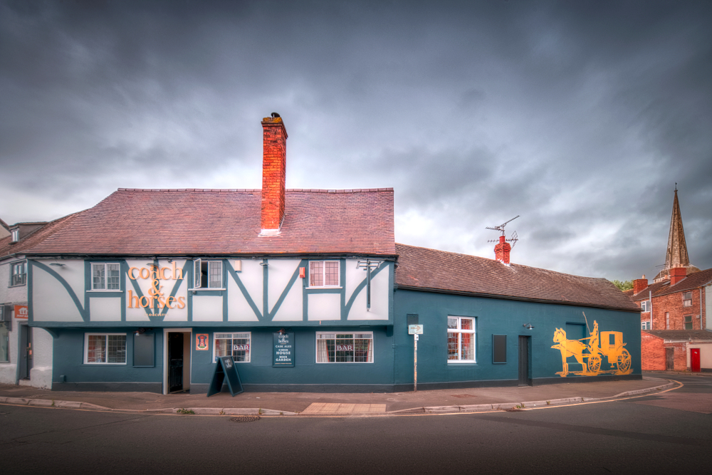 Top of Hare Lane and the site, to the right of the Coach & Horses, of Alvin Gate