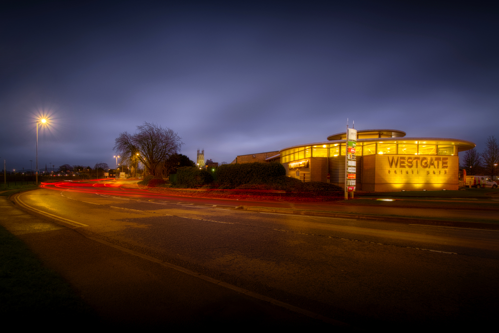 Vehicle light trails round Westgate island at night